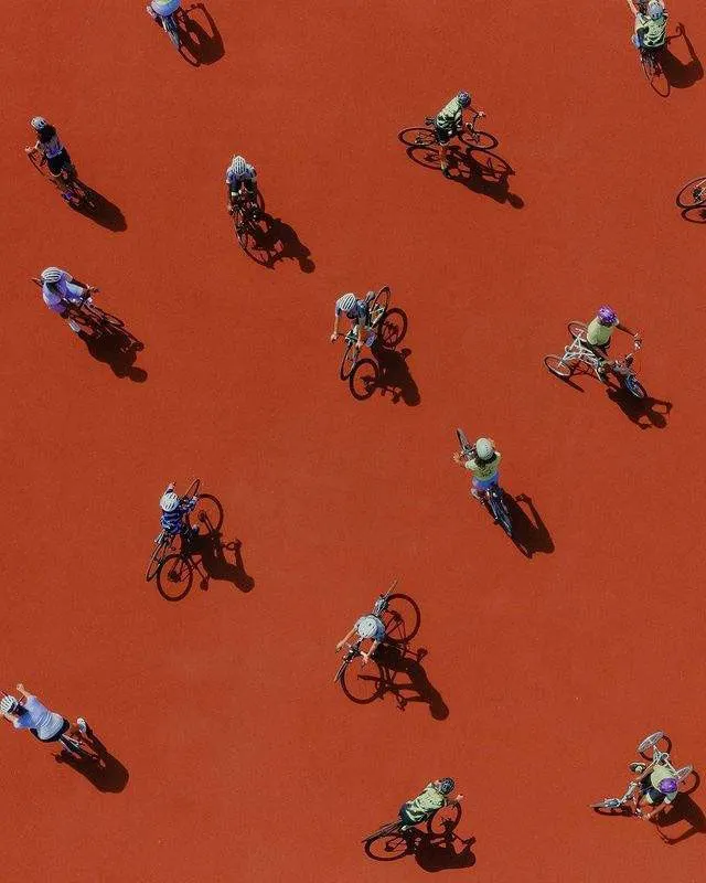 A group of people cycling together